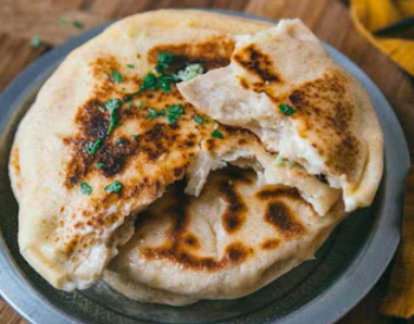 The Himalayan Chimney signature dishes The Classic Butter Chicken
Garlic Naan
Samosa